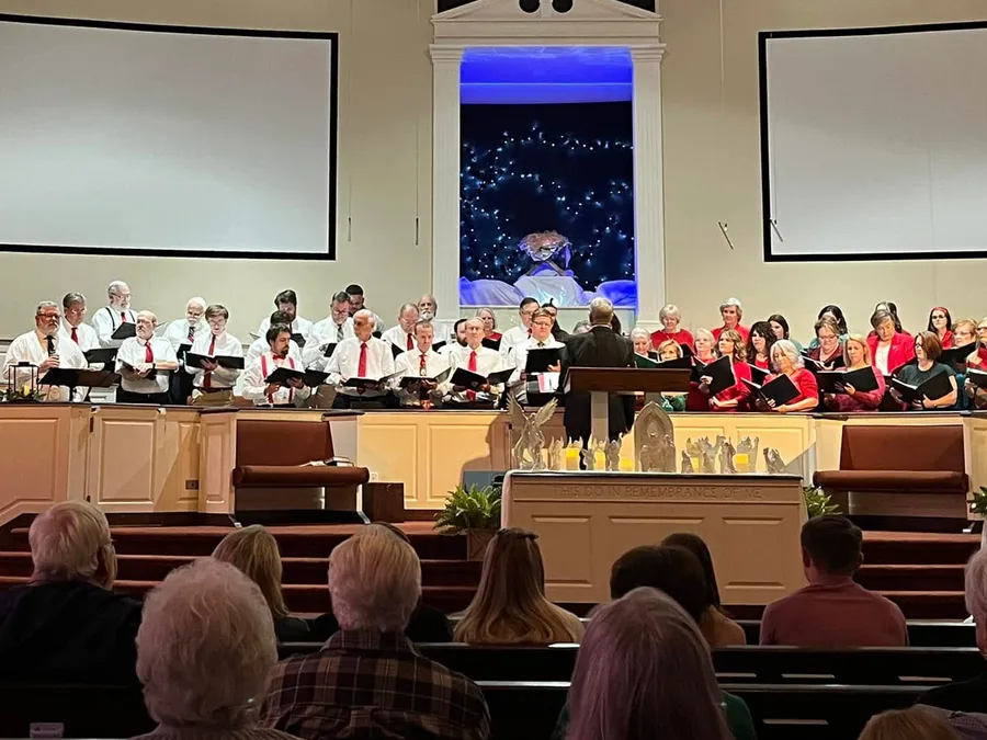The Oak Grove choir singing from the choir loft as the congregation looks on
